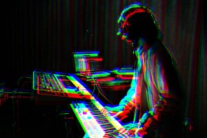 man playing electronic keyboard